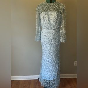 Made from Turkey, baby blue pearls and navy beads spread out on the dress